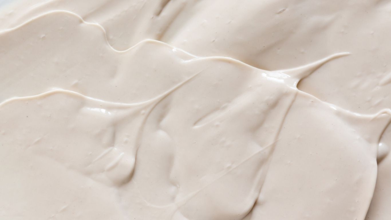 Close-up of smooth, beige cream texture