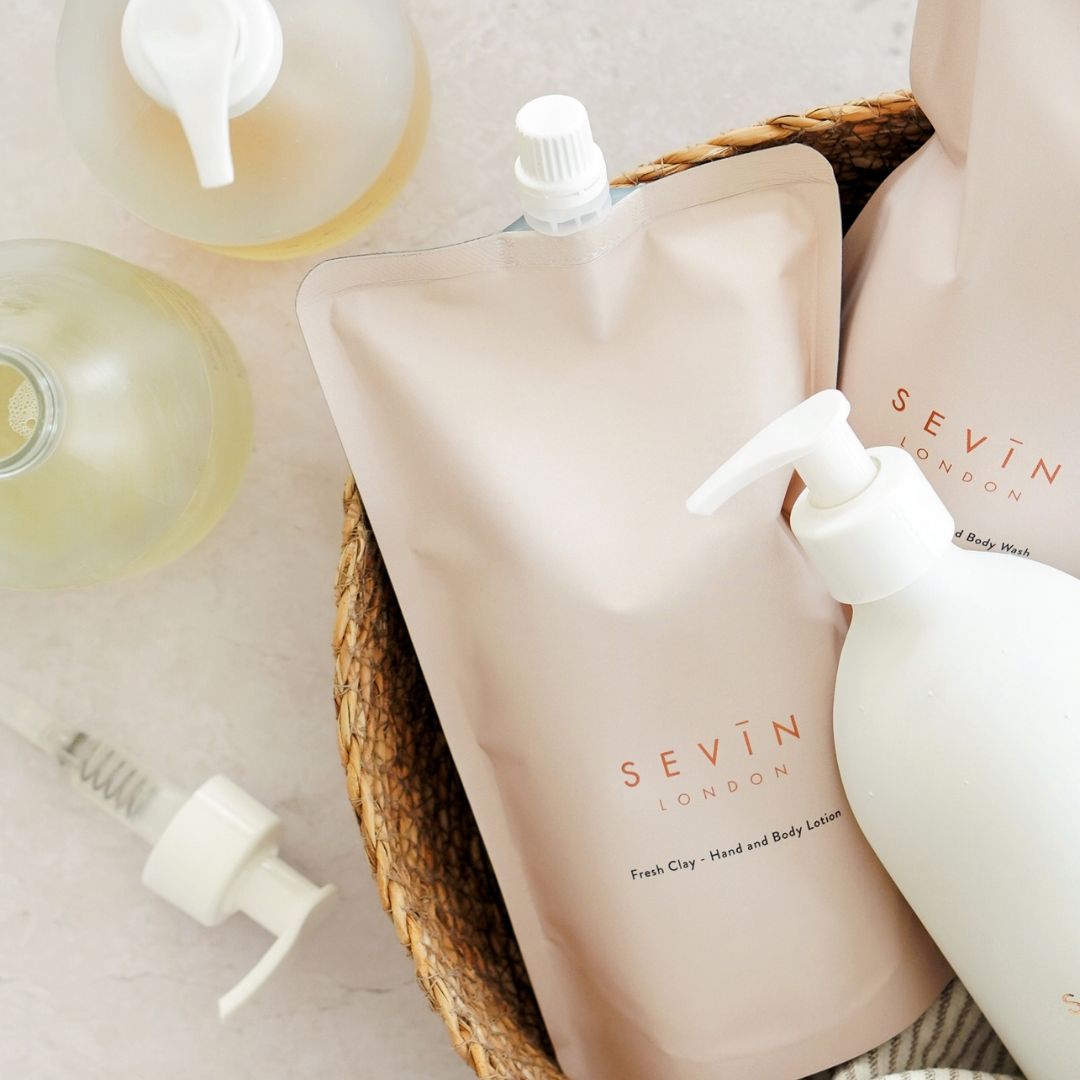 Sevin London body care products in a basket on a light background