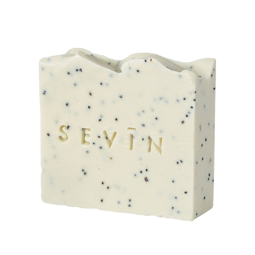 Bar of soap with speckled texture and 'SEVIN' branding on a white background